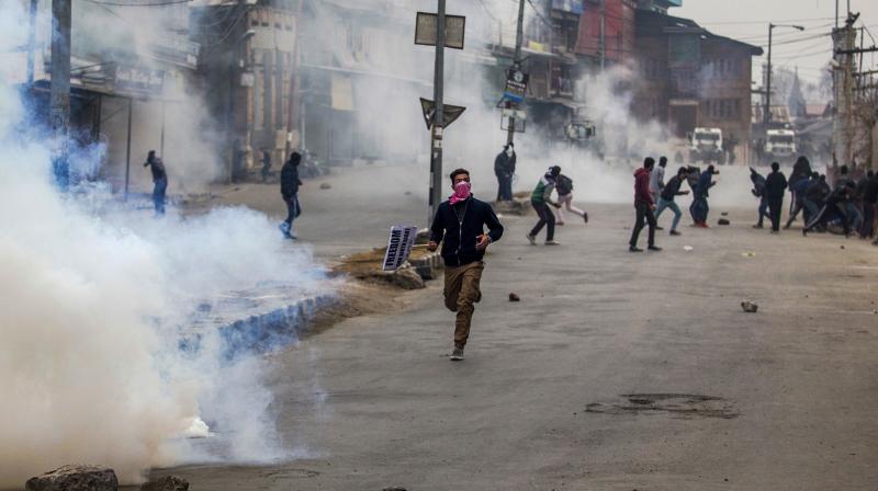 Protesters clash with police during a protest after Friday prayers in Srinagar. (Photo: AP)