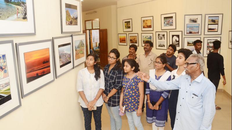 City-based veteran photographer K. Bhaskara Rao explains about the rare pictures of Vizag taken by him to youngsters at a photo expo held at Visakha Museum on Saturday.