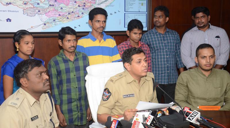 Vizag Rural SP Rahul Dev Sharma and other officers produce four Maoist militia members who surrendered before mediapersons in Visakhapatnam on Saturday. (Photo: DC)