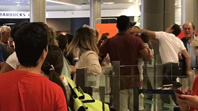 EasyJet employee hitting man holding baby after delay of over 14hours (Photo: Twitter)