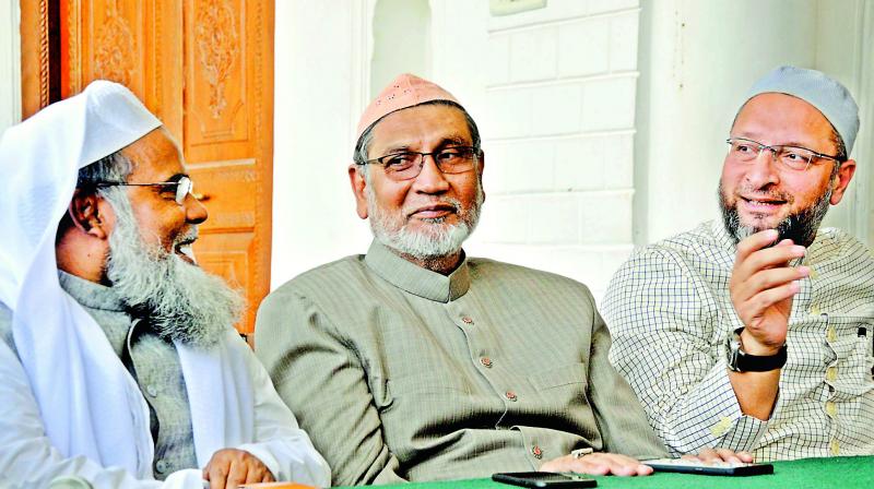 All India Muslim Personal Law Board general secretary Maulana Khalid Saifullah Rahmani along with MIM chief along with Hyderabad MP Asaduddin Owasi (right) and a member of board Akbar Nizamuddin (centre) address the media on the issue of triple talaq at Darussalam, in the city on Thursday. 	    (Image: P. Surendra)