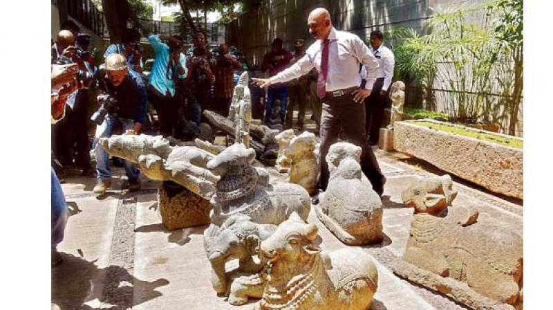 IG Pon Manickavel inspects idol seized from business man house on Thursday.    Image; DC