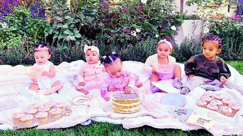 Cousins love: Khlo©s daughter True Thompson with Kylies daughter Stormi, Kims kids Chicago and Saint, and Robs daughter Dream