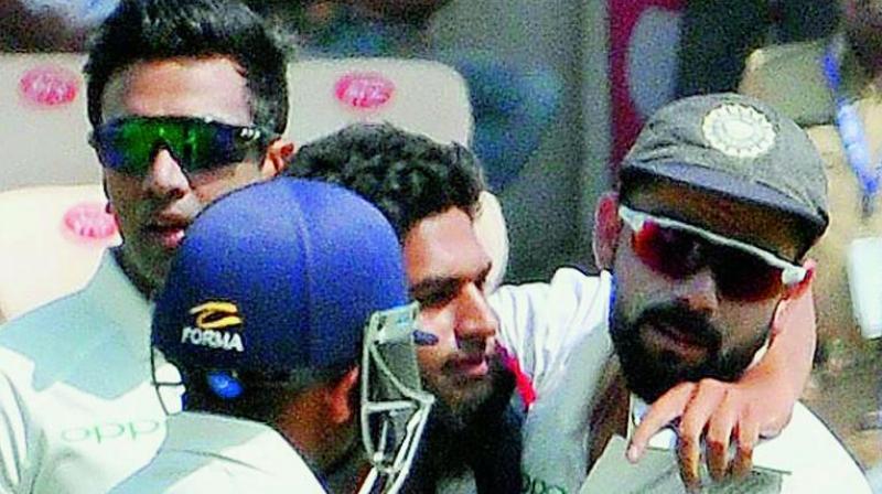 Khan was seeing hugging Kohli, despite the latter pushing him away. He also took a selfie with Kohli before the security personnel could take him away.