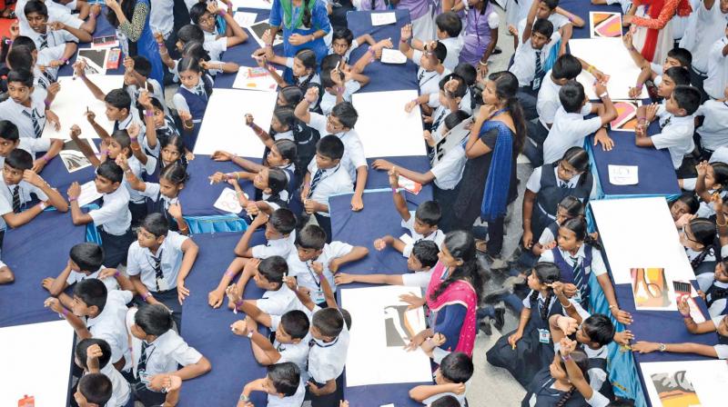 Around 1,000 children from various schools from in and around Coimbatore create a new Guinness World Record & Asian Book of Records - Ennangalilum, Vannangalilum Kalam for the most number of persons to colour simultaneously on Saturday.	Image; DC