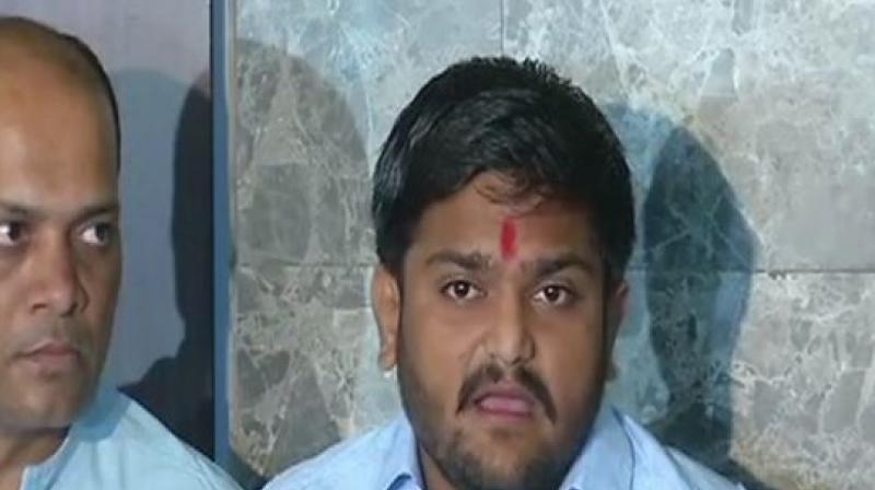 Patidar Anamat Andolan Samiti (PAAS) convener Hardik Patel said Congress will introduce a bill in the Gujarat Assembly for the reservation, if they win the forthcoming elections. (Photo: ANI | Twitter)