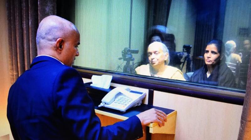 Picture tweeted by news agency ANI from a Pakistan media where Kulbhushan Jadhav is seen meeting his wife and mother in Pakistan. (Photo: Twitter | ANI)