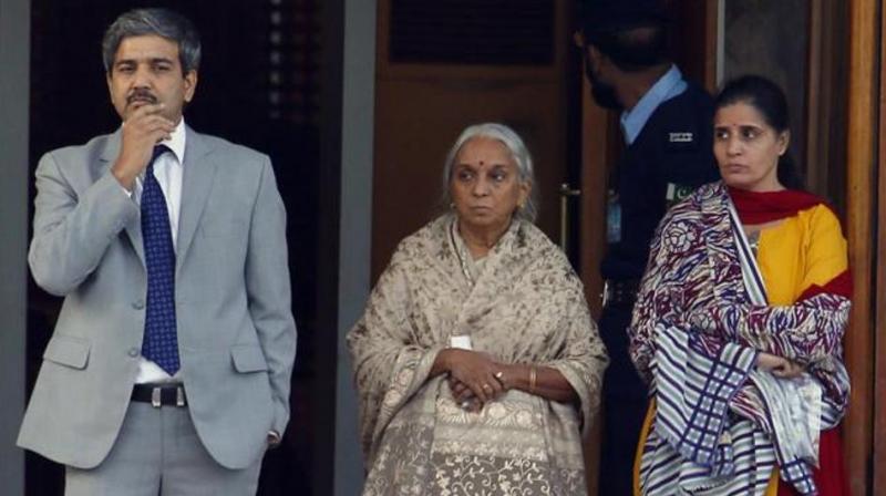The wife (R) and mother (centre) of Kulbhushan Jadhav are escorted by an Indian diplomat after their meeting with Jadhav at the foreign ministry in Islamabad. (Photo: AP)