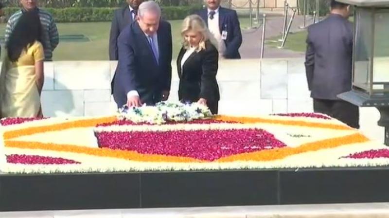 After getting a ceremonial reception at the Rashtrapati Bhavan, Netanyahu and his wife moved to Rajghat, where they paid tributes to Mahatma Gandhi. (Photo: ANI/Twitter)