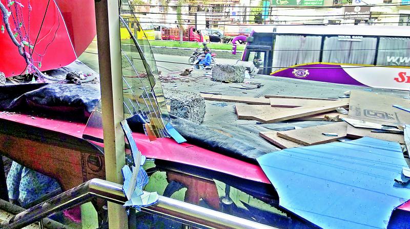 Shattered glass and a broken window are seen at Shah Ghouse restaurant following a blast caused by gas leakage on Friday.