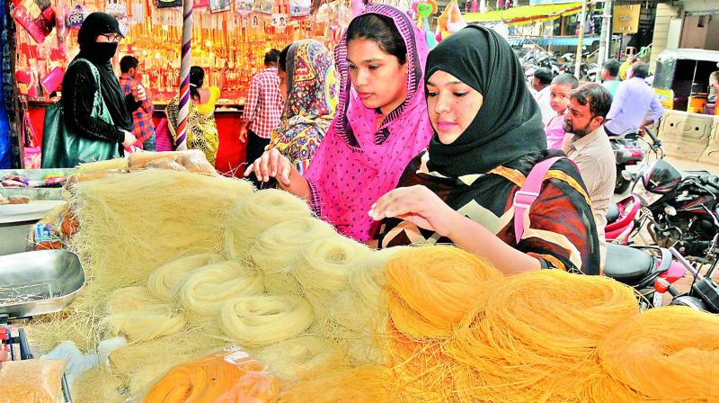 People purchase Vermicelli (Seviyan) ahead of Id-Ul-Fitr in the Old City of Hyderabad on Sunday. (Photo: DC)