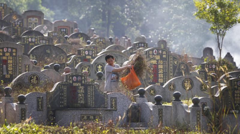 Tomb-Sweeping Day, also known as Qingming Festival, is the most important occasion for Chinese to honour their ancestors by burning joss sticks and paper money. (Photo: AP)