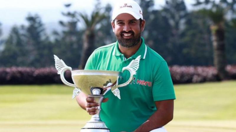 Shiv Kapur poses with the winners trophy.