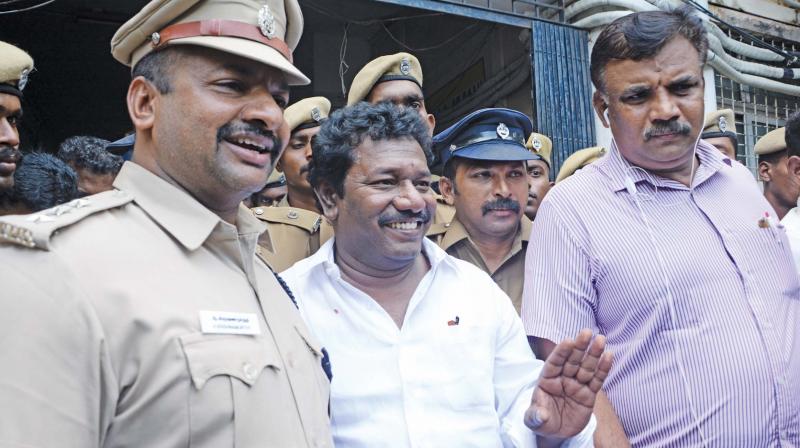Tiruvadanai MLA S. Karunas was arrested at his Chennai residence on Sunday is being brought out of the Royapettah GH after a check up before being housed in the Puzhal jail.  (Photo:DC)