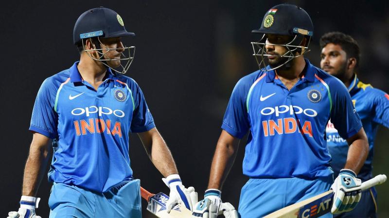 Indias Mahendra Singh Dhoni and Rohit Sharma after India won the 3rd ODI match against Sri Lanka at Kendy on Sunday. (Photo: AP)