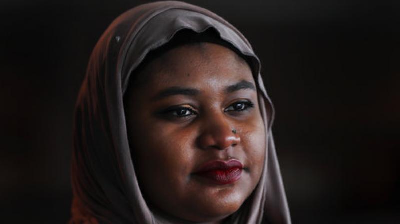 Fatimah Farooq is shown, Tuesday, March 14, 2017 in Ann Arbor, Mich. Farooq counsels refugees from places like Iraq and Syria, who have been victims of trauma, torture or sex trafficking. Personally, she tries to help relatives from Sudan, some of whom have faced barriers resettling in the United States as her parents did right before she was born. In between, she is trying to navigate being black, Muslim and a daughter of immigrants.(AP Photo/Paul Sancya)