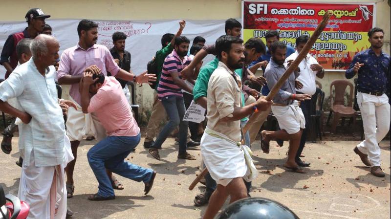 SFI and ABVP members clash during the Anti-SFI Cultural Meet conducted by old students in front of Sree Kerala Varma College in Thrissur on Friday. (Photo: DC)