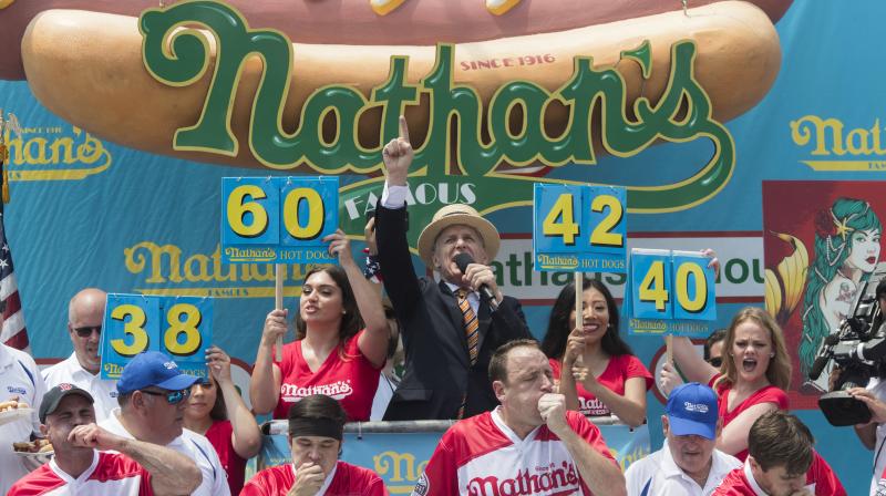74 hot dogs in 10 minutes: What it took to win a Fourth of July contest