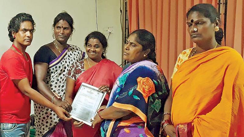 Judge Jayanthi (centre) hands over the death certificate to trangenders mom.