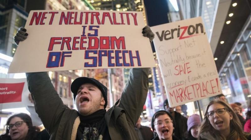 Demonstrators rally in support of net neutrality outside a Verizon store in New York. Any changes are likely to happen slowly, and companies will try to make sure that consumers are on board with the moves, experts say. (AP Photo/Mary Altaffer, File)