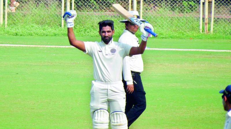 Hyderabad batsman Bavanaka Sandeep celebrates his double century on the second day of the Group C Ranji Trophy match against Services in Mumbai on Monday.