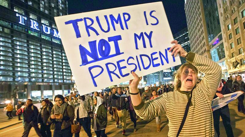 Demonstrators protest outside of the Trump Tower on Wednesday in Chicago, Illinois. Thousands of people across the United States took to the streets in protest a day after Republican Donald Trump was elected president, defeating Democrat Hillary Clinton. (Photo: AFP)