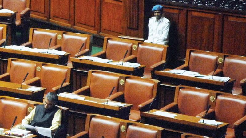 Only Minister Krishna Byregowda and a Marshall seen during the Assembly Session at Vidhana Soudha in Bengaluru on Friday. (Photo: KPN)