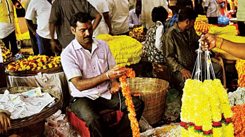 Flower vendors in K.R. Market have been hit by currency demonetisation and poor rainfall in Bengaluru. (Photo: DC)