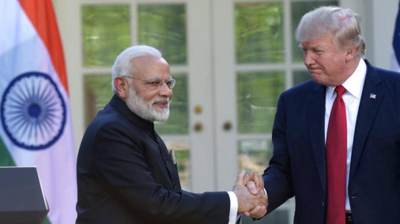 Donald Trump, Narendra Modi President Donald Trump and Indian Prime Minister Narendra Modi shake hands while making statements in the Rose Garden of the White House in Washington.