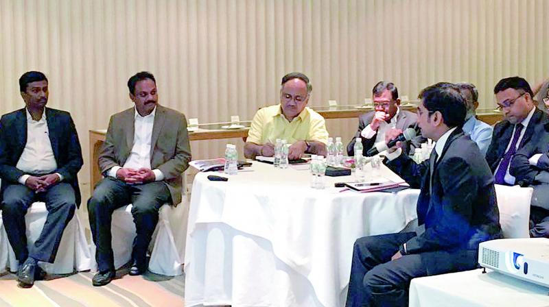 APCRDA commissioner Cherukuri Sridhar conducts Amaravati financing round-table meeting in Vijayawada on Friday. (Photo: DC)