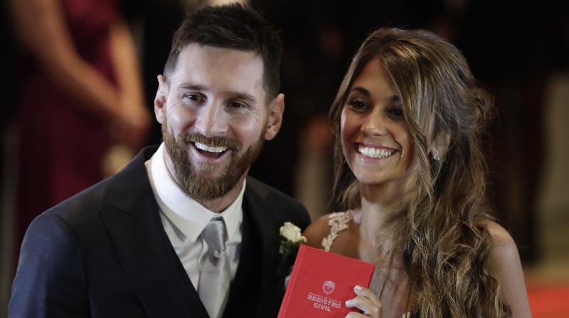 The couple - Lionel Messi and Antonella Roccuzzo - met as children. He moved to Spain when he was 13 to join FC Barcelona, but they kept in touch. (Photo: AP)