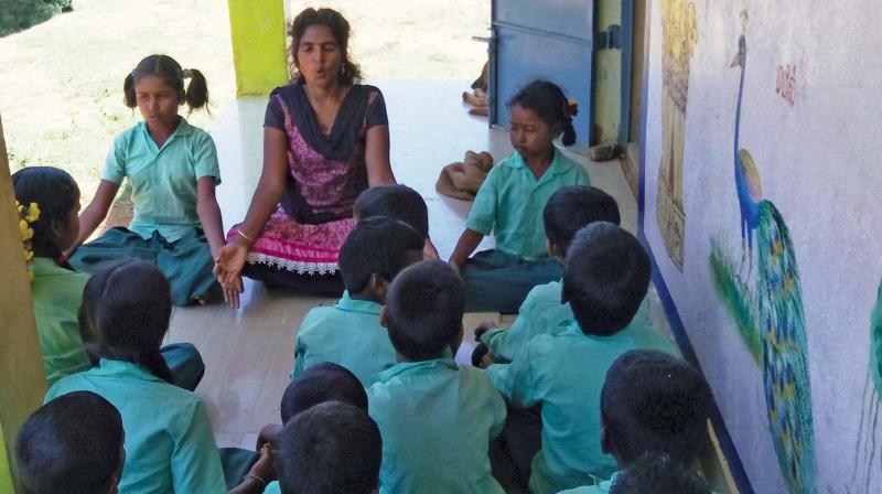 Sagaya Shanthi teaches yoga to the school  children. 		(Image: DC)