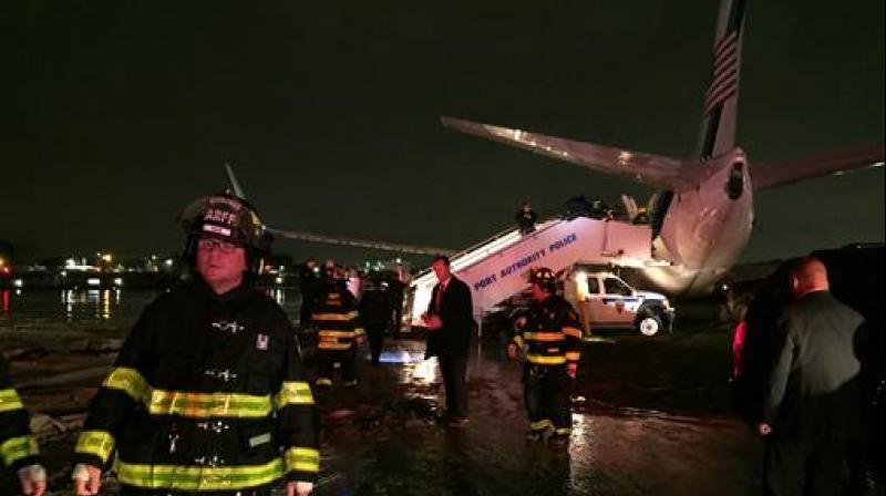 The campaign plane of Republican vice presidential candidate Indiana Gov. Mike Pence sits off a runway at New Yorks LaGuardia Airport after it slid off a runway during a rainstorm during landing. Pence told reporters that no one had been injured. (Photo: AP)