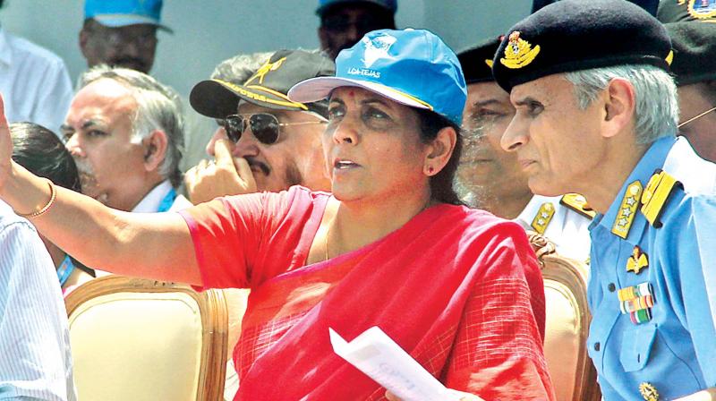 Defence Minister Nirmala Sitharaman on Sunday discusses a point with Defence official while witnessing a dry run of Land, Naval and Aero defence systems at Thiruvidanthai, about 40 km from Chennai where the four-day DefExpo 2018 will begin on April 11 (Photo: DC)