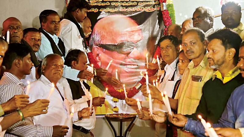 Karnataka unit of DMK condoling the demise of party supremo, M. Karunanidhi, in Bengaluru on Tuesday  KPN (right)