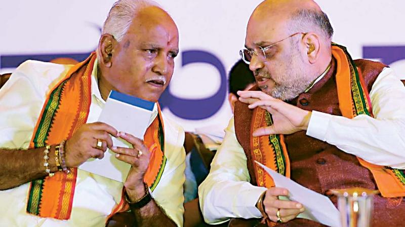 A file photo of state BJP president B.S. Yeddyurappa with party chief Amit Shah