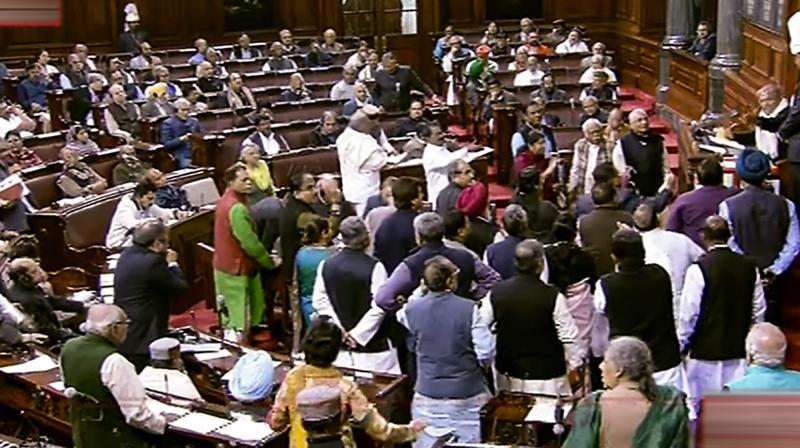 Opposition members protest in Rajya Sabha during Winter Session of Parliament. (Photo: RSTV grab via PTI)