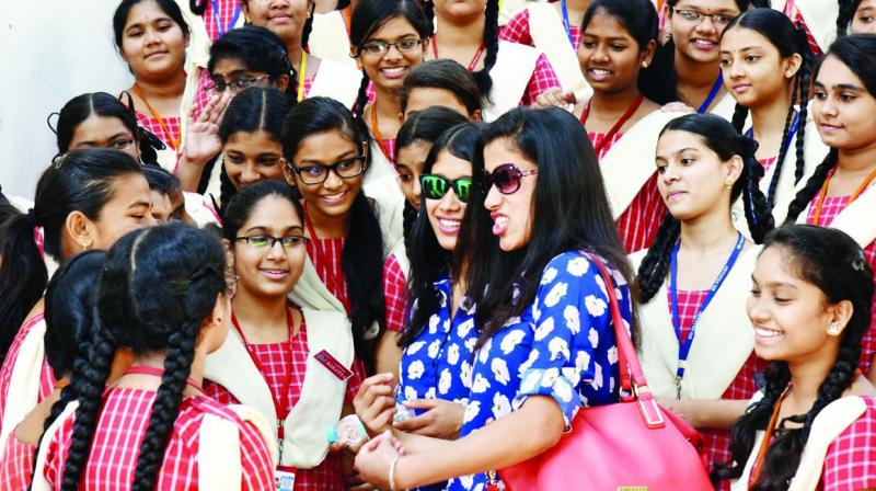 Young mountaineers Nungshi and Tashi Malik interact with children during their visit to a school during its 16th annual day celebrations in Visakhapatnam on Monday. (Photo: DC)