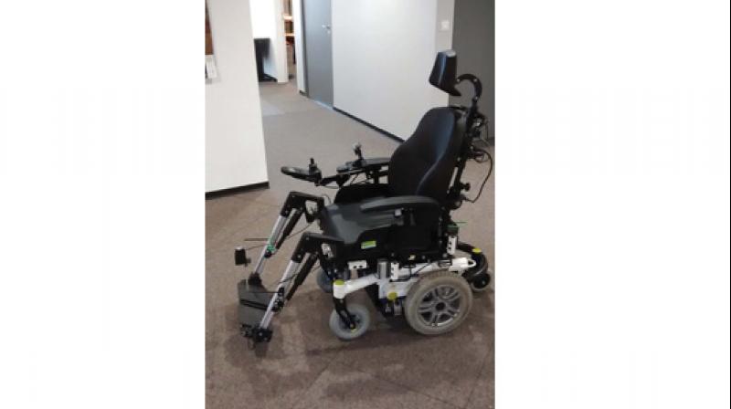 Assistive wheelchair robot that he developed.