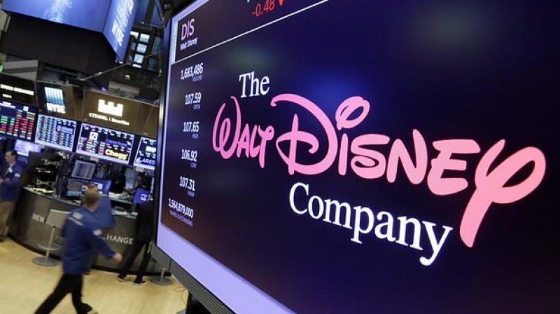 The Walt Disney Co. logo appears on a screen above the floor of the New York Stock Exchange. Photo: AP