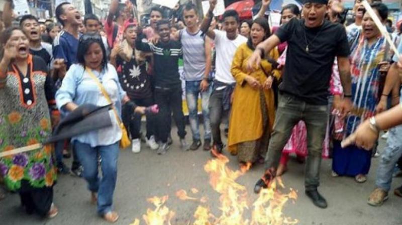 Gorkha Janmukti Morcha (GJM) supporters during their protest in Darjeeling on Thursday. (Photo: PTI)