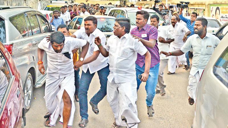 A protester being chased and roughed up near former CM O. Panneerselvams house on Greenways Road. (Photo: DC)