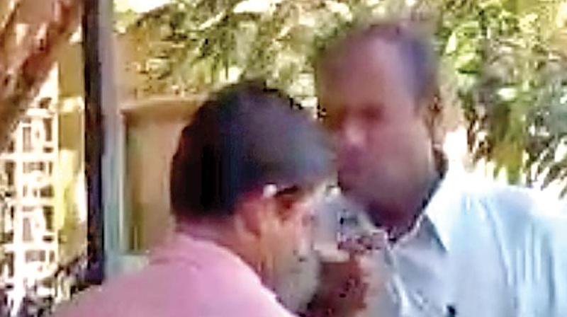 A video grab shows a senior official scolding a staff at the Coimbatore collectorate on Thursday. (Photo: DC)