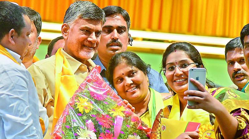 Telugu Mahila members take a selfie with Telugu Desam national president and AP Chief Minister N. Chandrababu Naidu at the partys Telangana Mahanadu at Exhibition Grounds, Nampally, in Hyderabad on Wednesday. (Photo: DC)