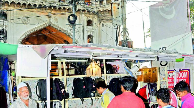 Tourists keep their luggages with a private contractor outside Charminar. (Photo: DC)