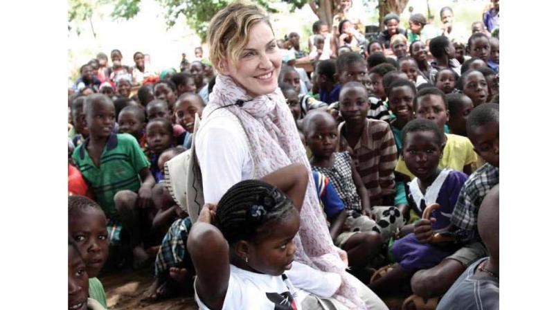 Unlike other celebs, who believe in bringing up kids in isolated environments, Madonna is different.