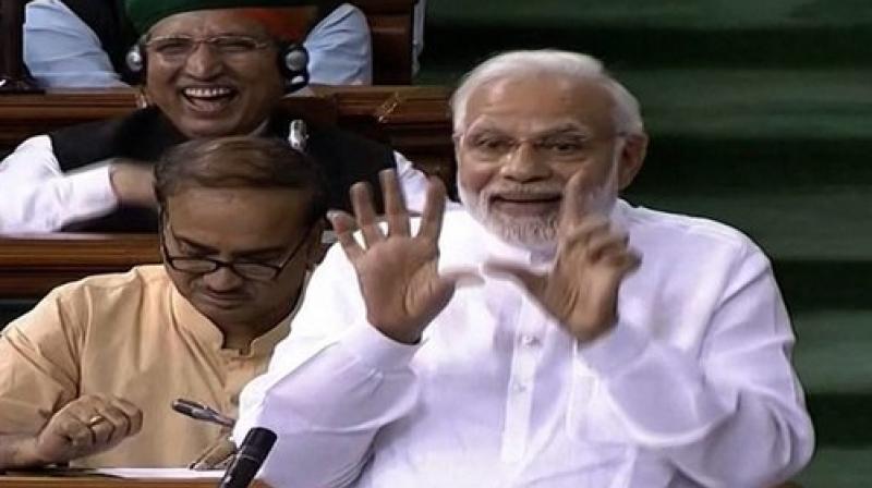 Prime Minister Narendra Modi speaks in the Lok Sabha on no-confidence motion during the Monsoon Session of Parliament. (Photo: LSTV GRAB via PTI)