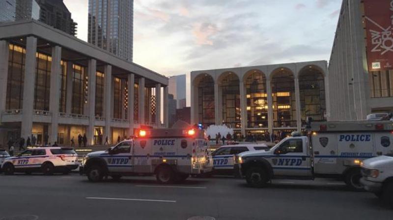 Police respond to New Yorks Metropolitan Opera that had halted a performance after someone sprinkled an unknown powder into the orchestra pit. (Photo: AP)