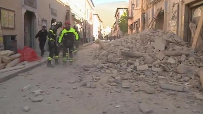 In this image made from video, firefighters clean the road blocked by rubbles fallen from a damaged building in Norcia, Italy. (Photo: AP)