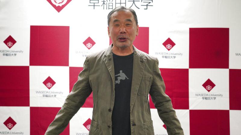 Japanese novelist Haruki Murakami poses for photographers during a press conference at Waseda University in Tokyo. (Photo: AP)